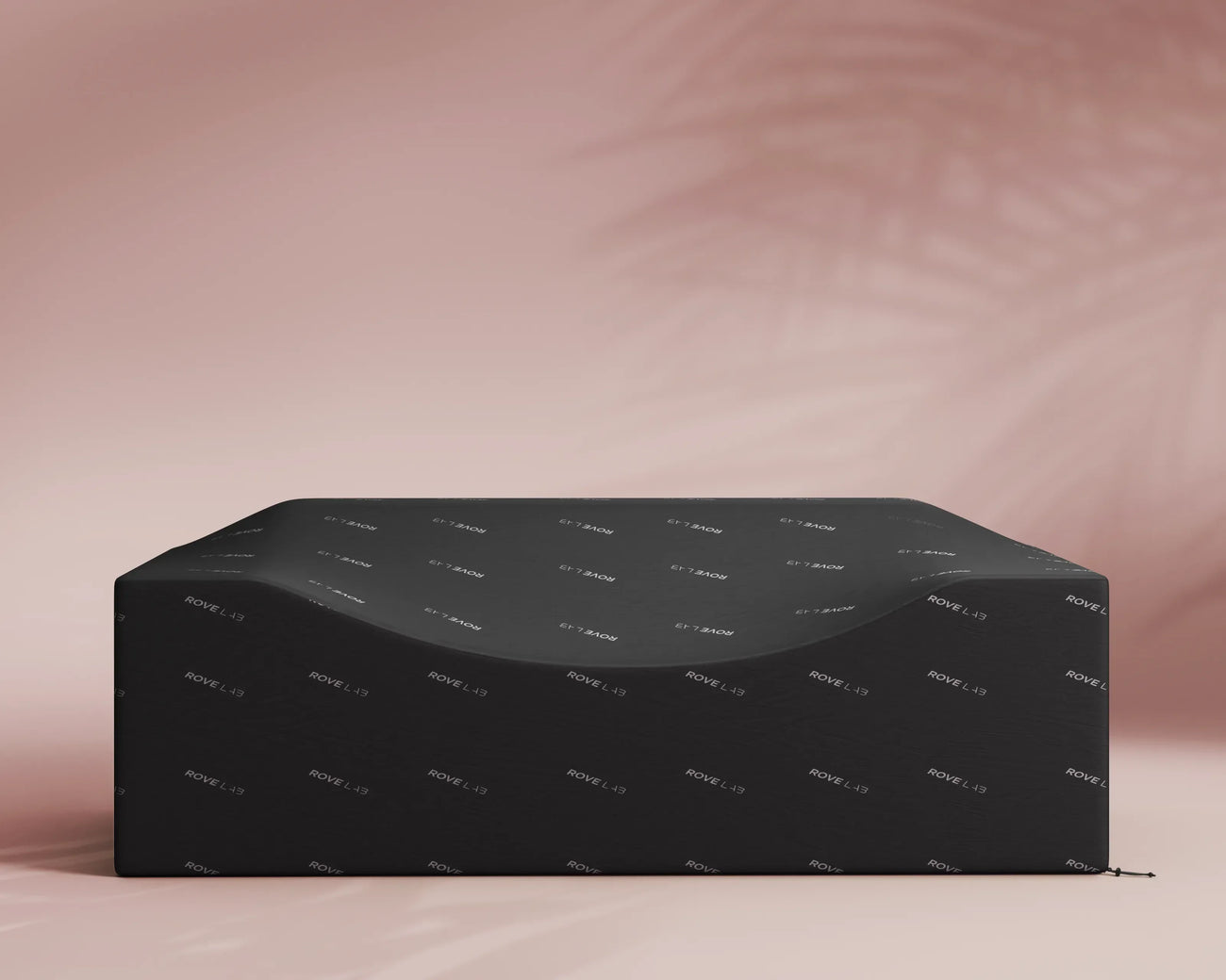 Black box with a pattern on a pink background