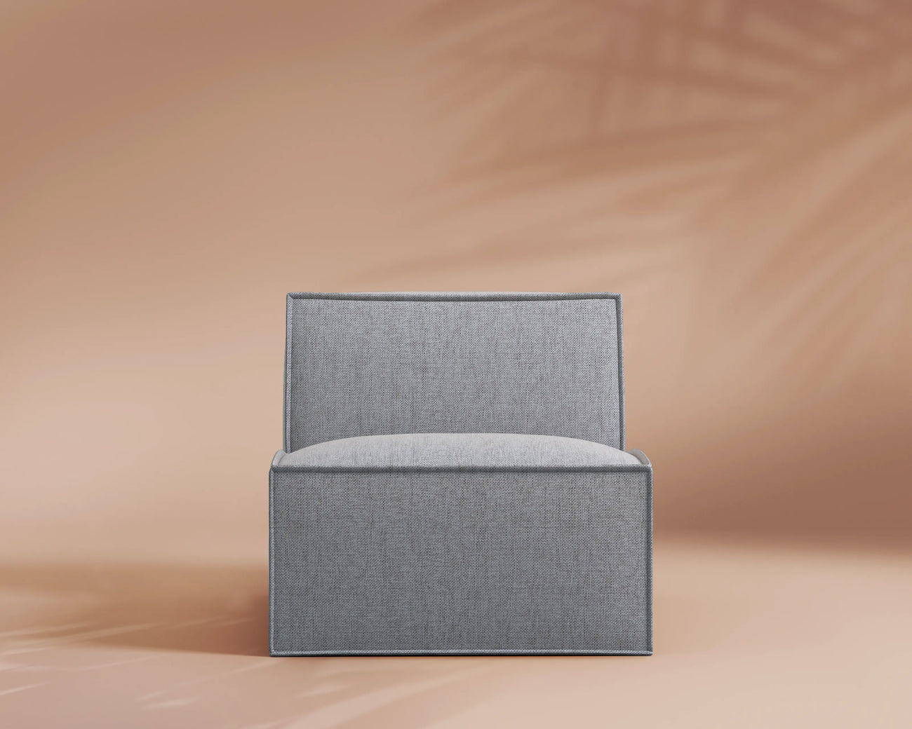 Gray upholstered chair on a beige background