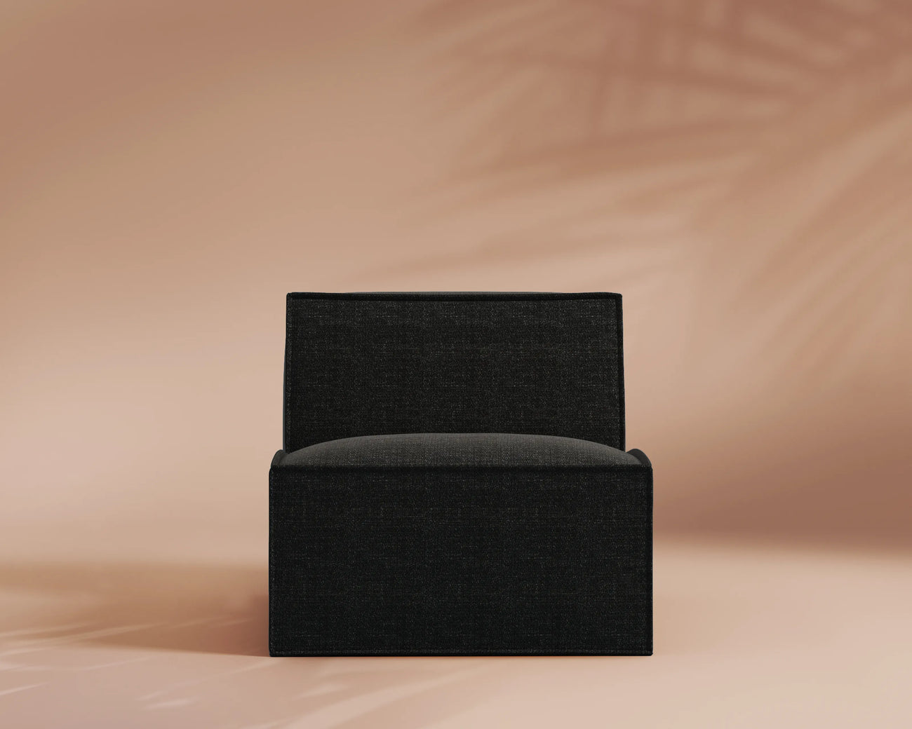 Black armchair on a beige background