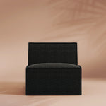 Black armchair on a beige background