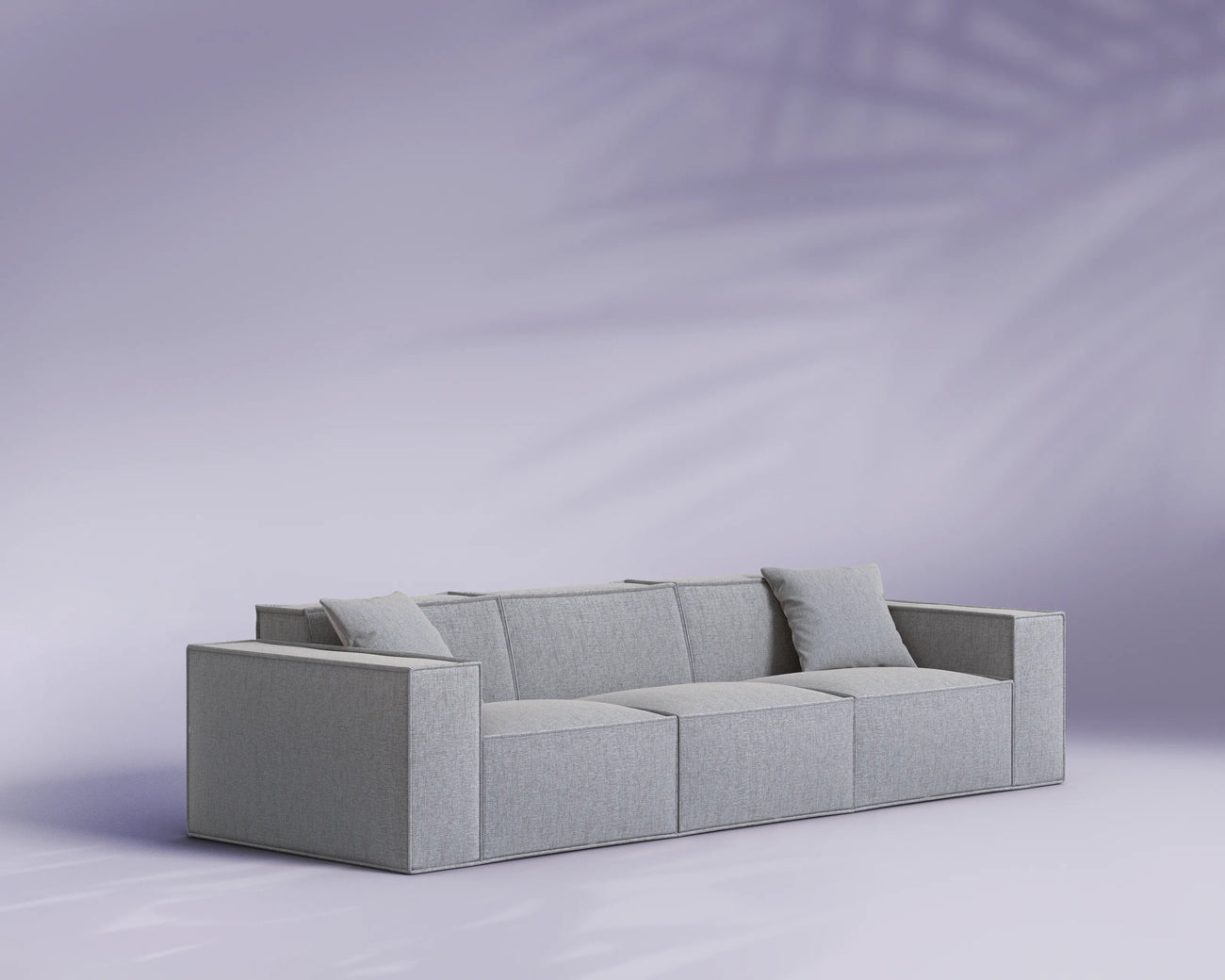 Gray sectional sofa on a light purple background